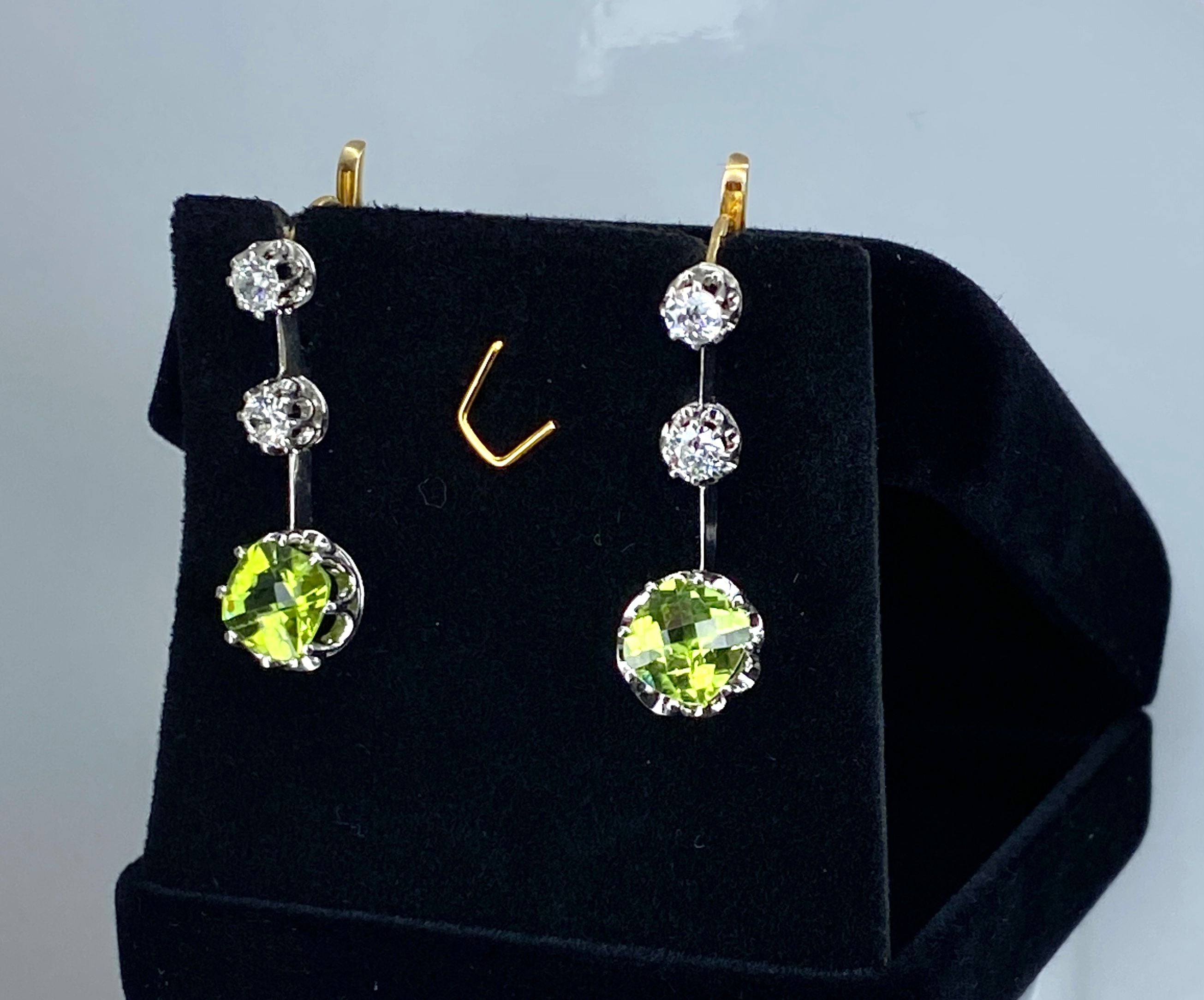 Gold earrings, paltinium, peridots and diamonds