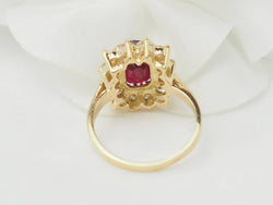 Ring ruby and diamonds surround