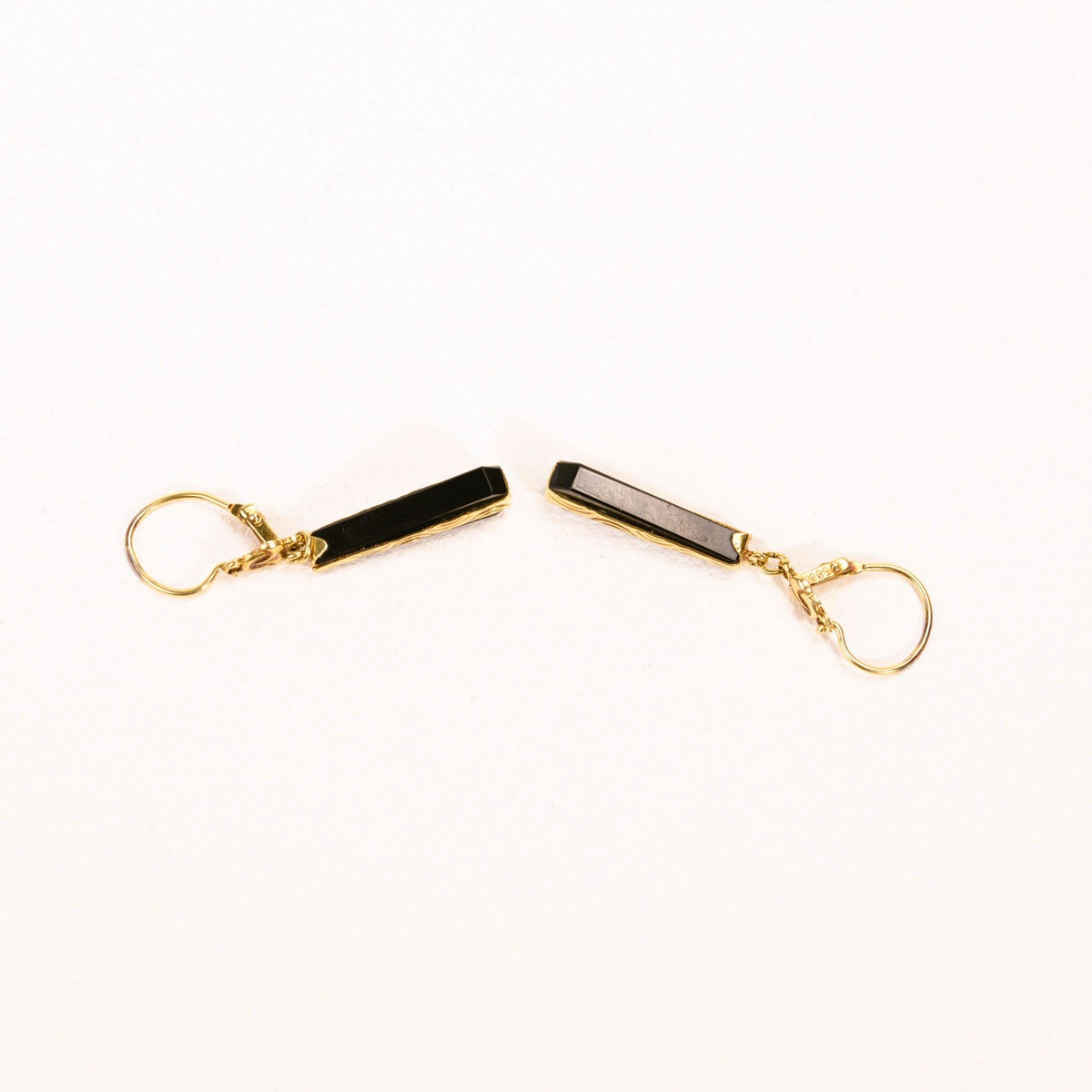 Onyx and yellow gold dangling sleeper earrings