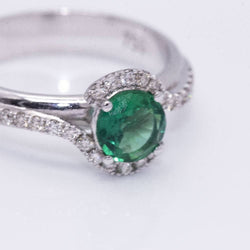 Ring at white gold, emerald and diamonds