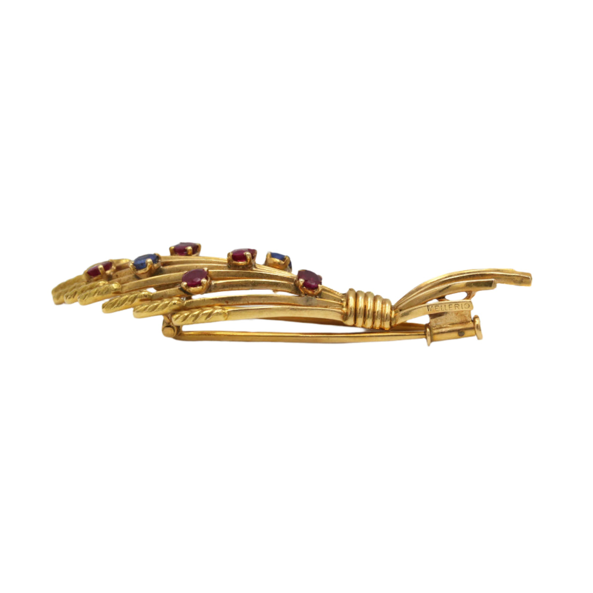 MELLERIO clip brooch in yellow gold, rubies, and sapphires