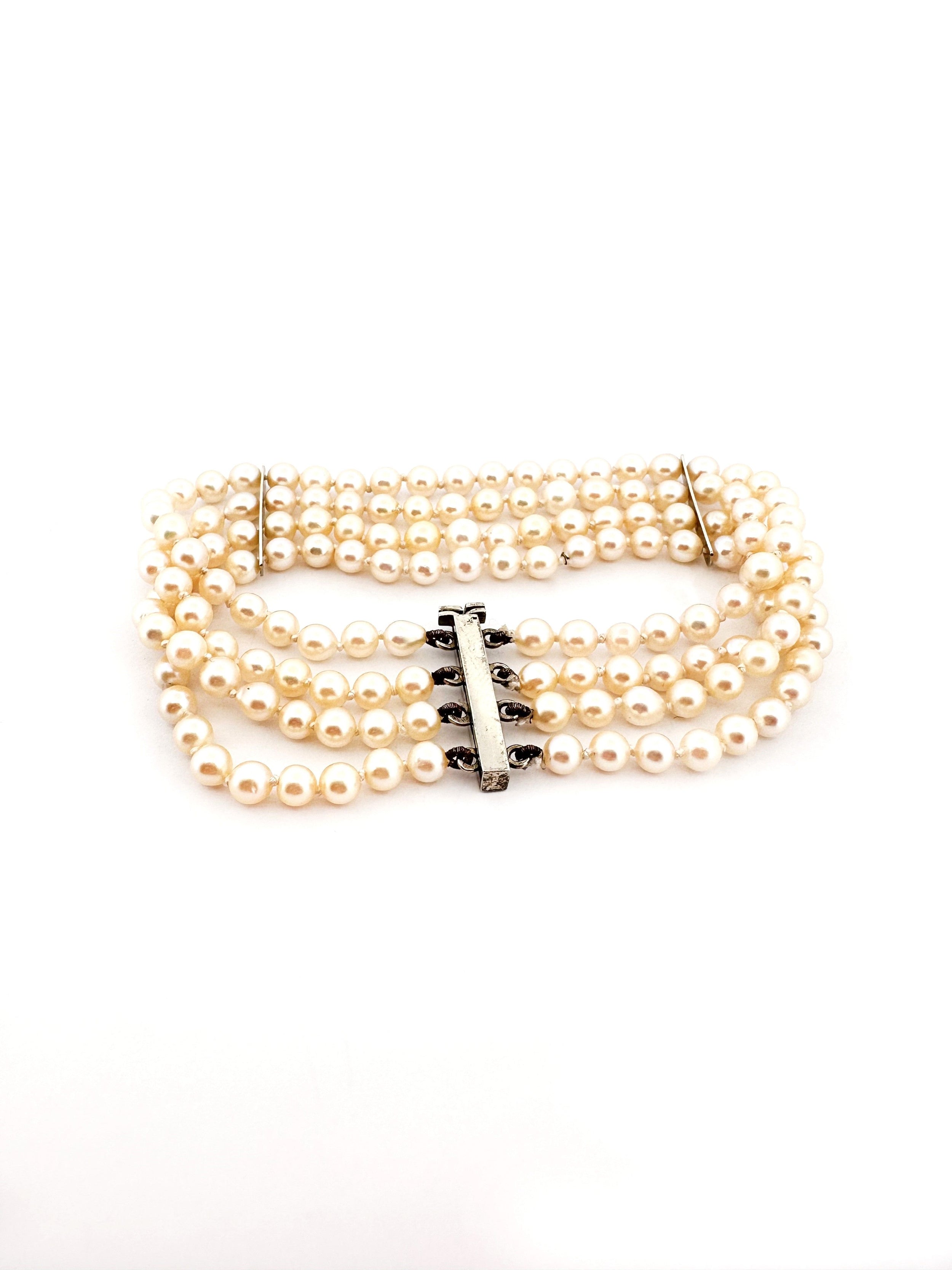 Bracelet Souple 4 rangs de perles blanches or blanc et diamants