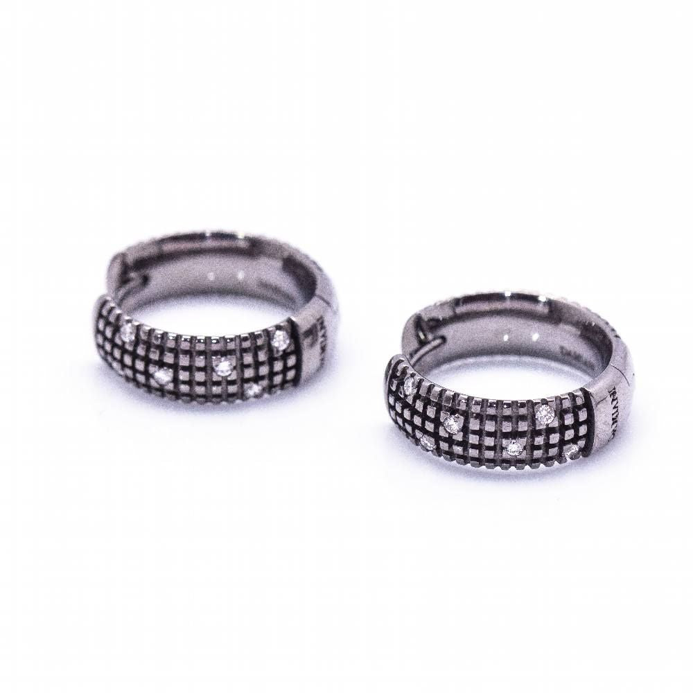 Boucles d'oreilles DAMIANI en or noir. D'occasion
