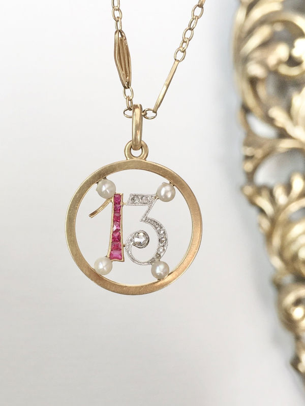 Pendant in yellow gold, paltinium, rubies, pearls and diamonds