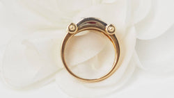 Two-tone gold ribbon ring with diamonds and rubies 