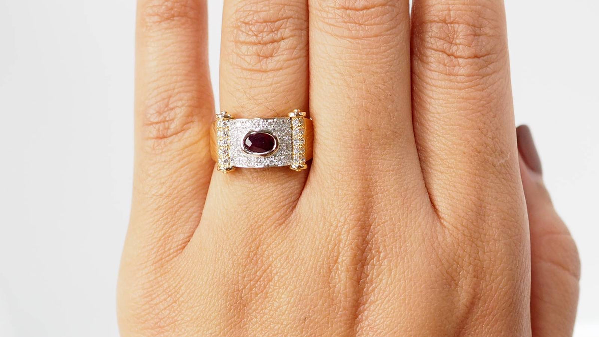 Two-tone gold ribbon ring with diamonds and rubies 