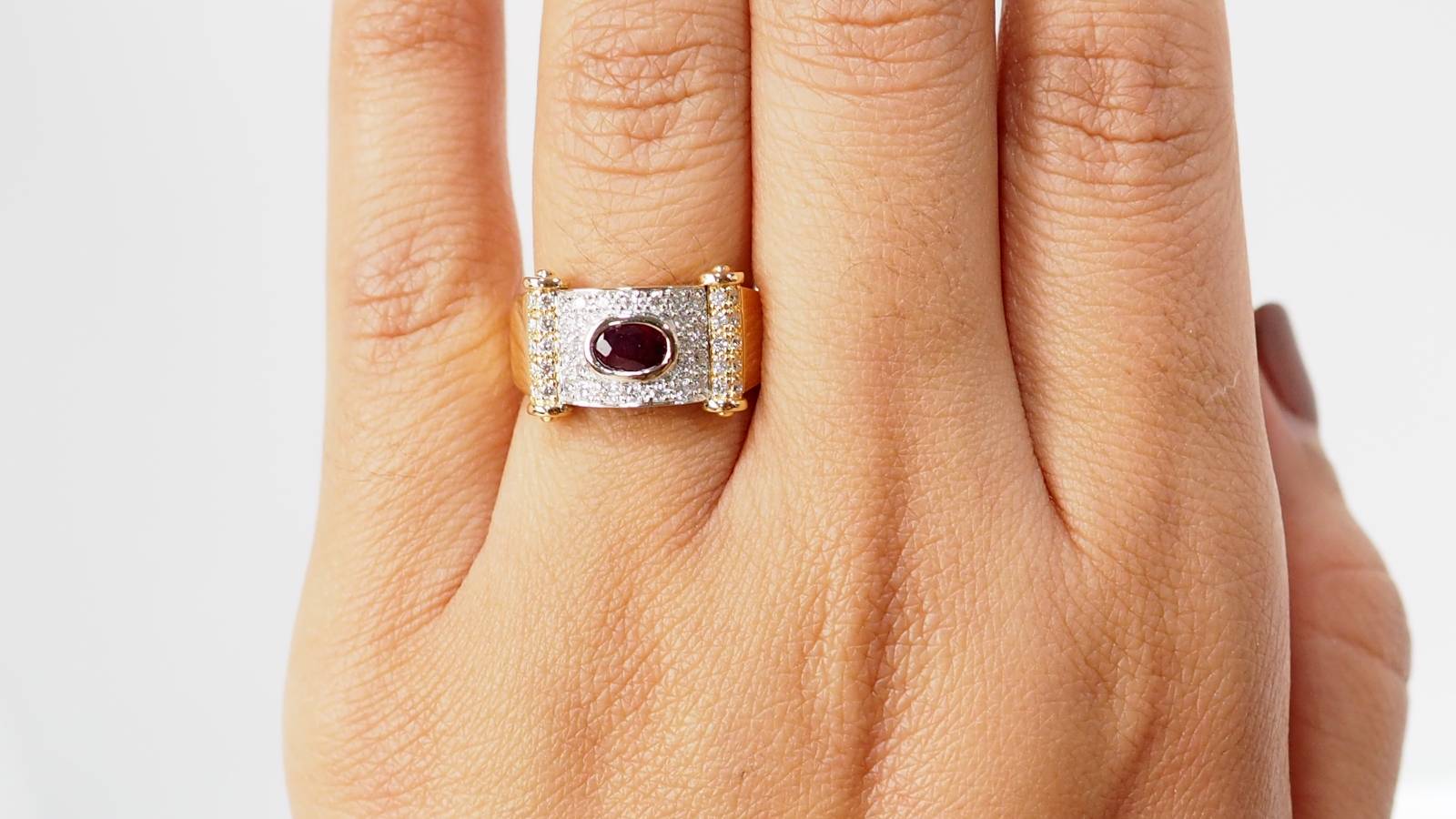 Two-tone gold ribbon ring with diamonds and rubies 