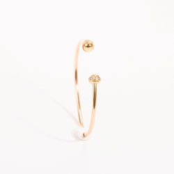 Open bangle bracelet in pink gold and diamonds