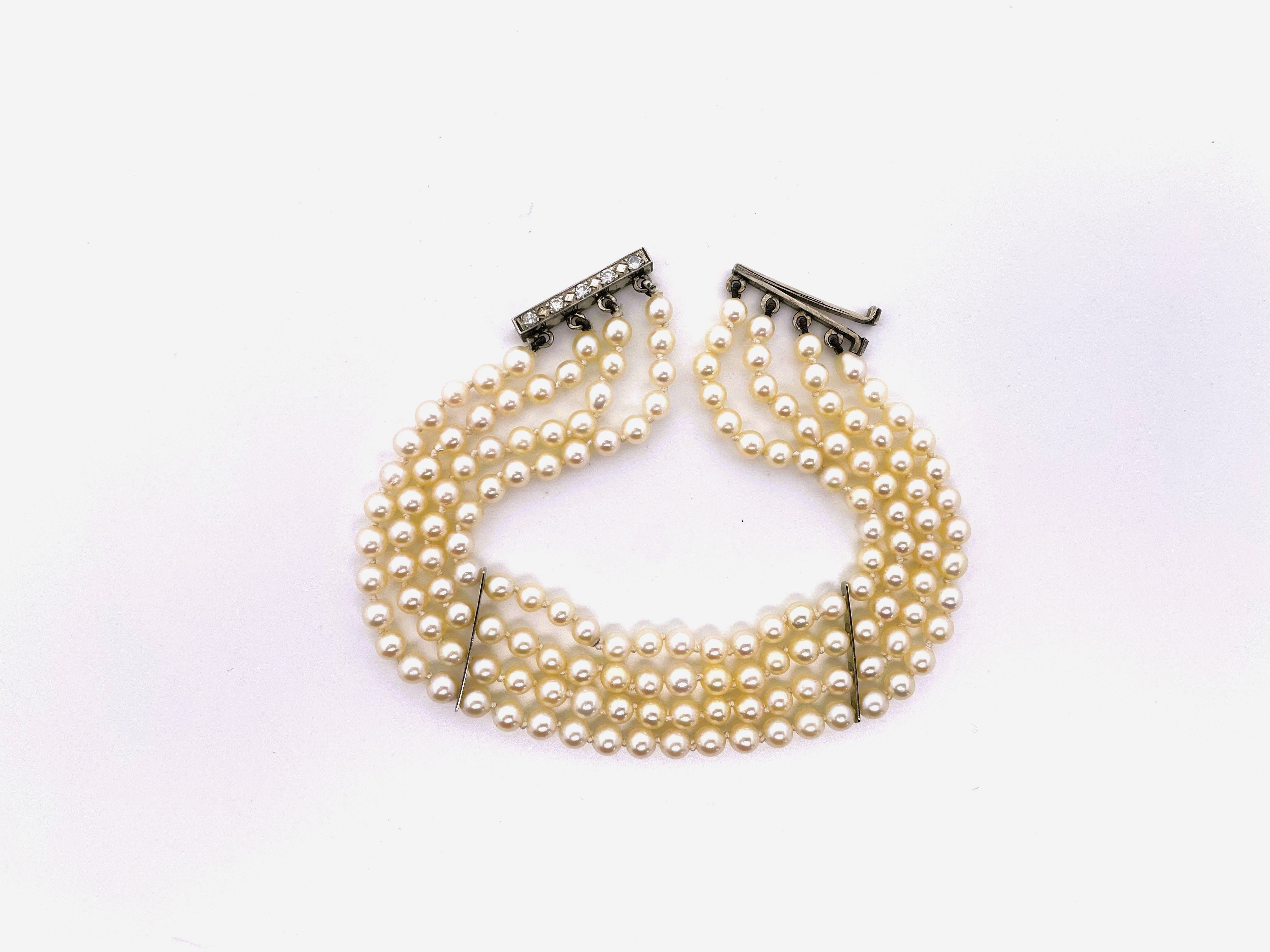 Bracelet Souple 4 rangs de perles blanches or blanc et diamants