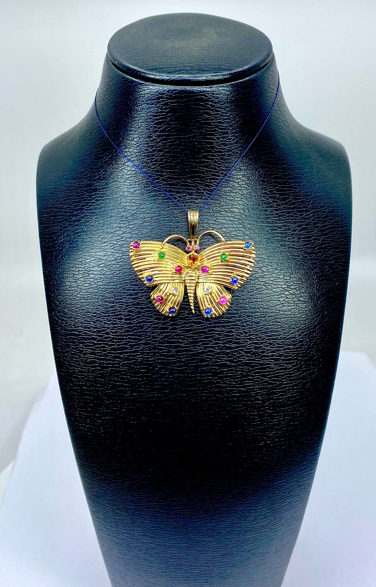 18-carat yellow gold and gemstone butterfly pendant
