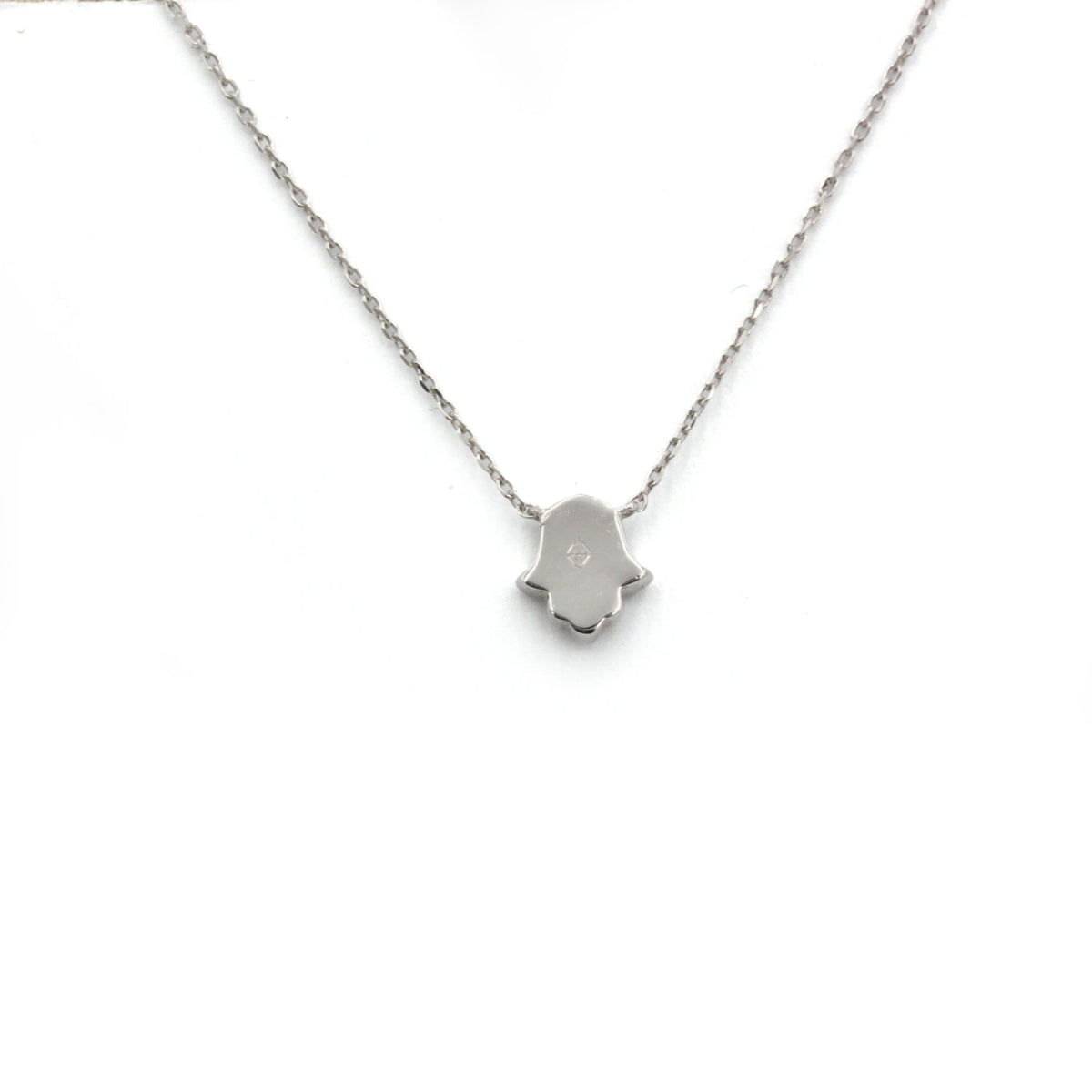 DJULA Magic Touch Hand Necklace in white gold and diamonds