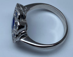 Bague marguerite en or 18 carats en saphirs et diamants