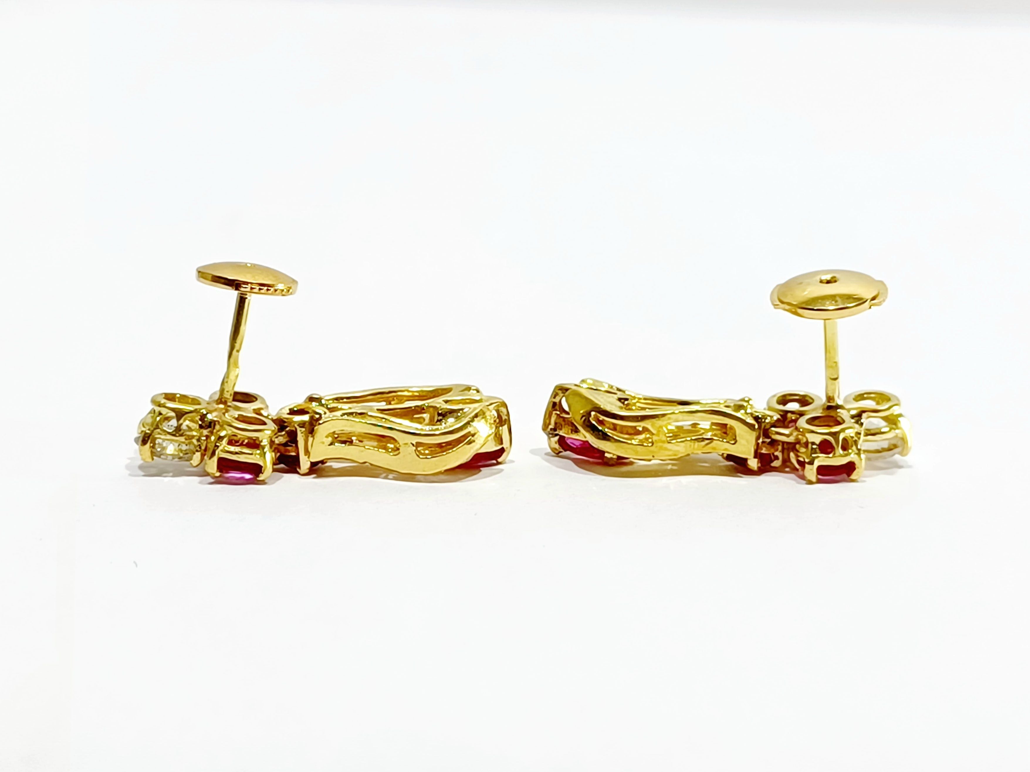A Pair Of Gold, Ruby And White Earrings diamonds