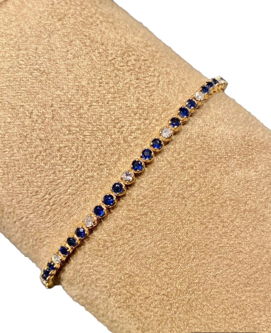 Tennis bracelet, in 14k yellow gold, sapphires and diamonds