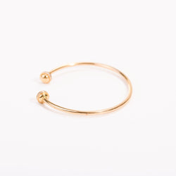 Open bangle bracelet in pink gold and diamonds