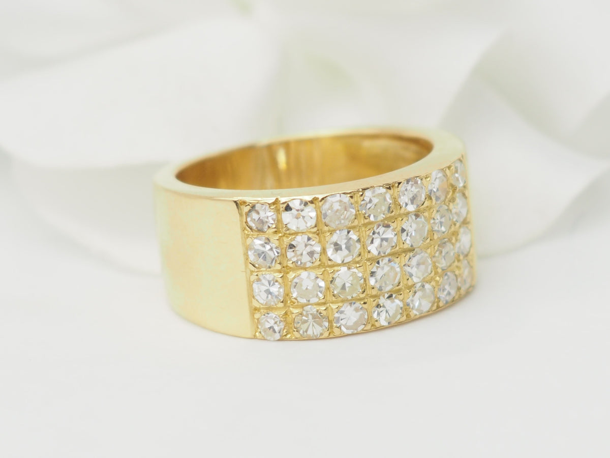 Yellow gold and diamond ribbon ring 