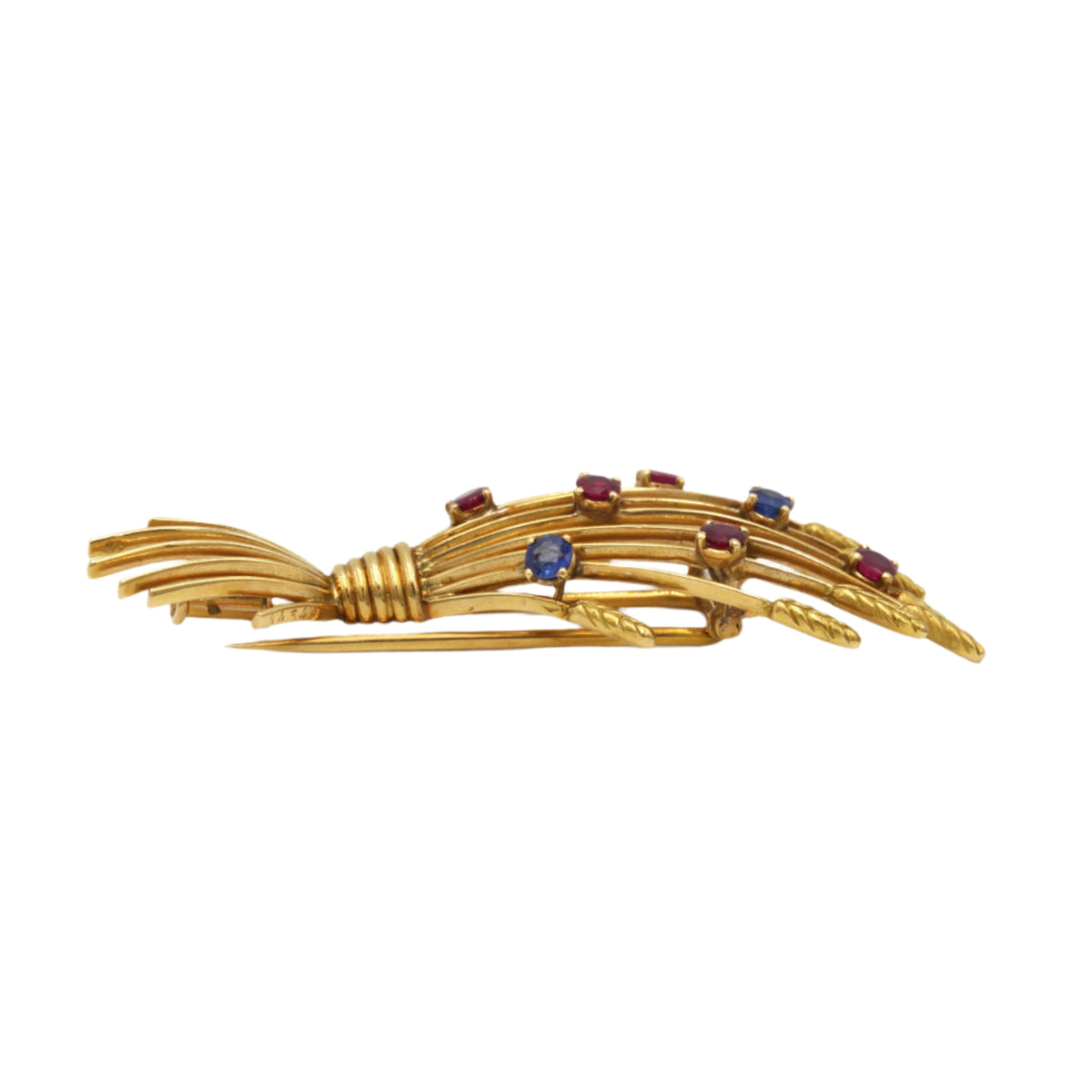 MELLERIO clip brooch in yellow gold, rubies, and sapphires