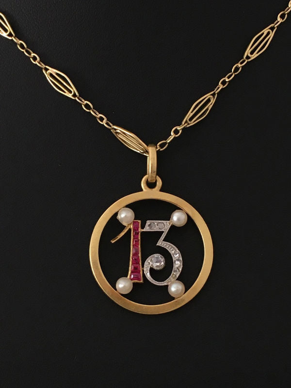 Pendant in yellow gold, paltinium, rubies, pearls and diamonds