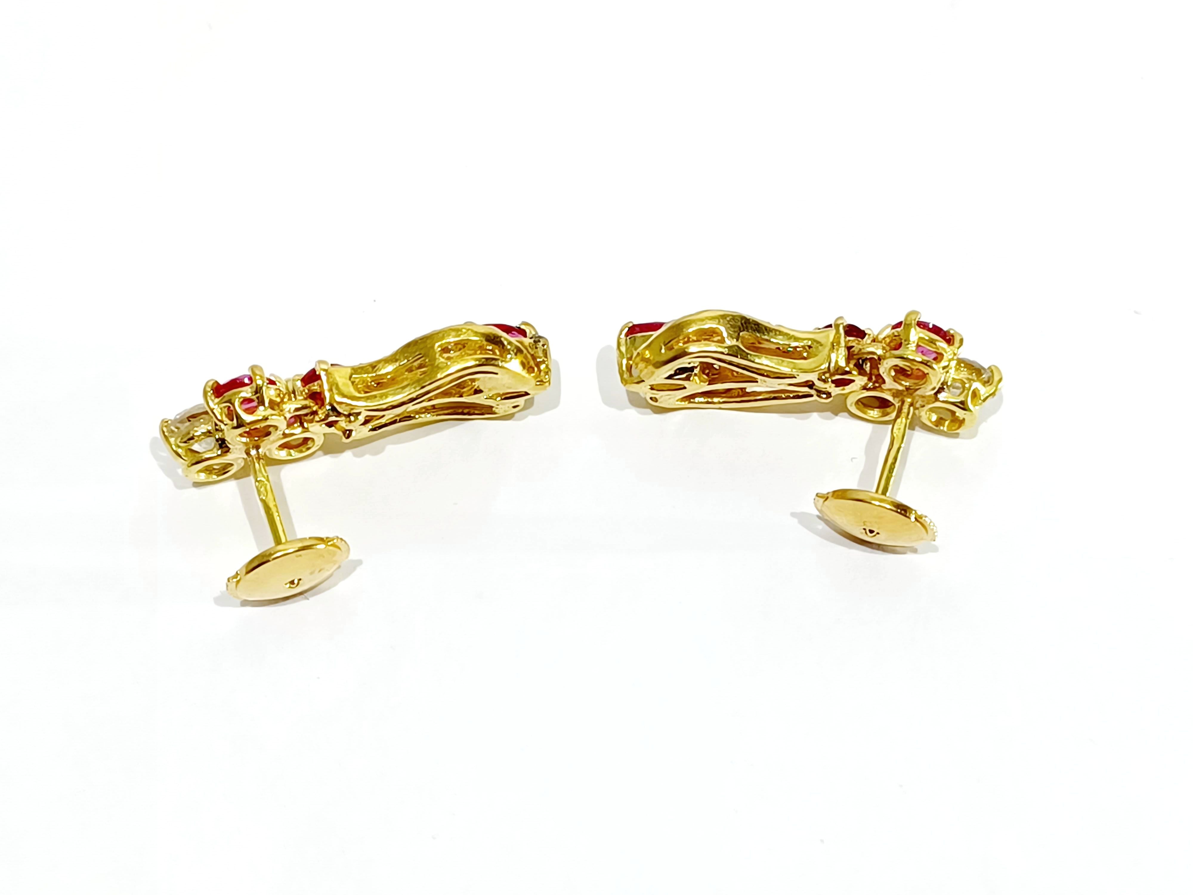A Pair Of Gold, Ruby And White Earrings diamonds