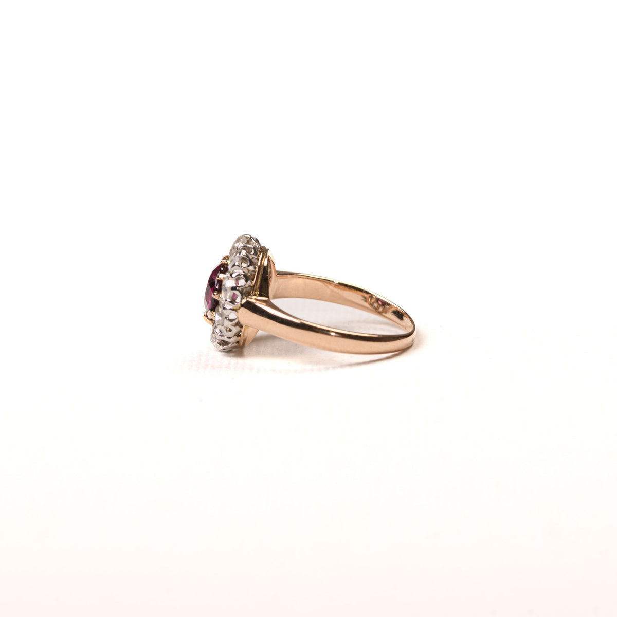 Antique daisy ring with rhodolite and diamonds in rose gold
