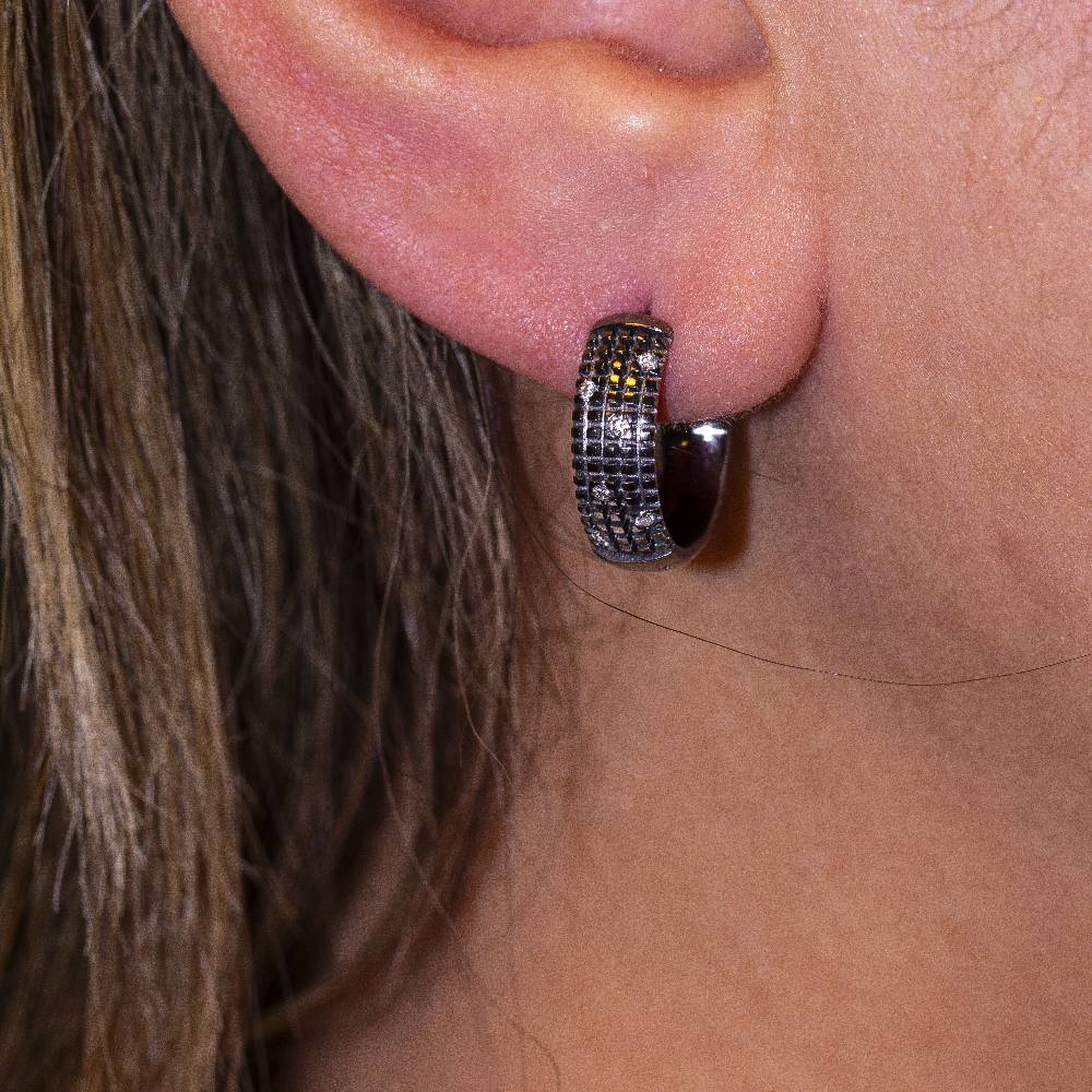 Boucles d'oreilles DAMIANI en or noir. D'occasion