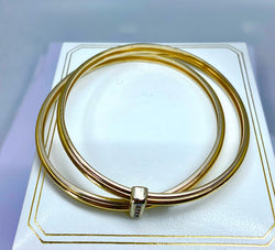 Bracelet double joncs or 18 carats, diamants, Yves Saint Laurent