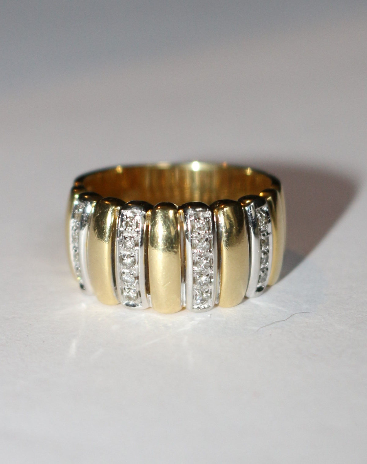 Two-tone gold and diamond gadrooned band ring