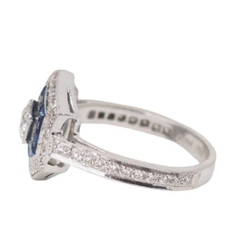Bague double entourage en or blanc, saphirs et diamants