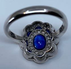 Bague marguerite en or 18 carats en saphirs et diamants