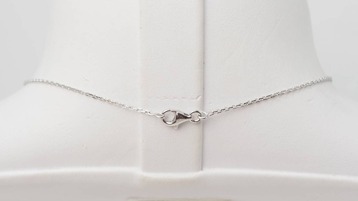 White gold, emerald and diamond pendant necklace 