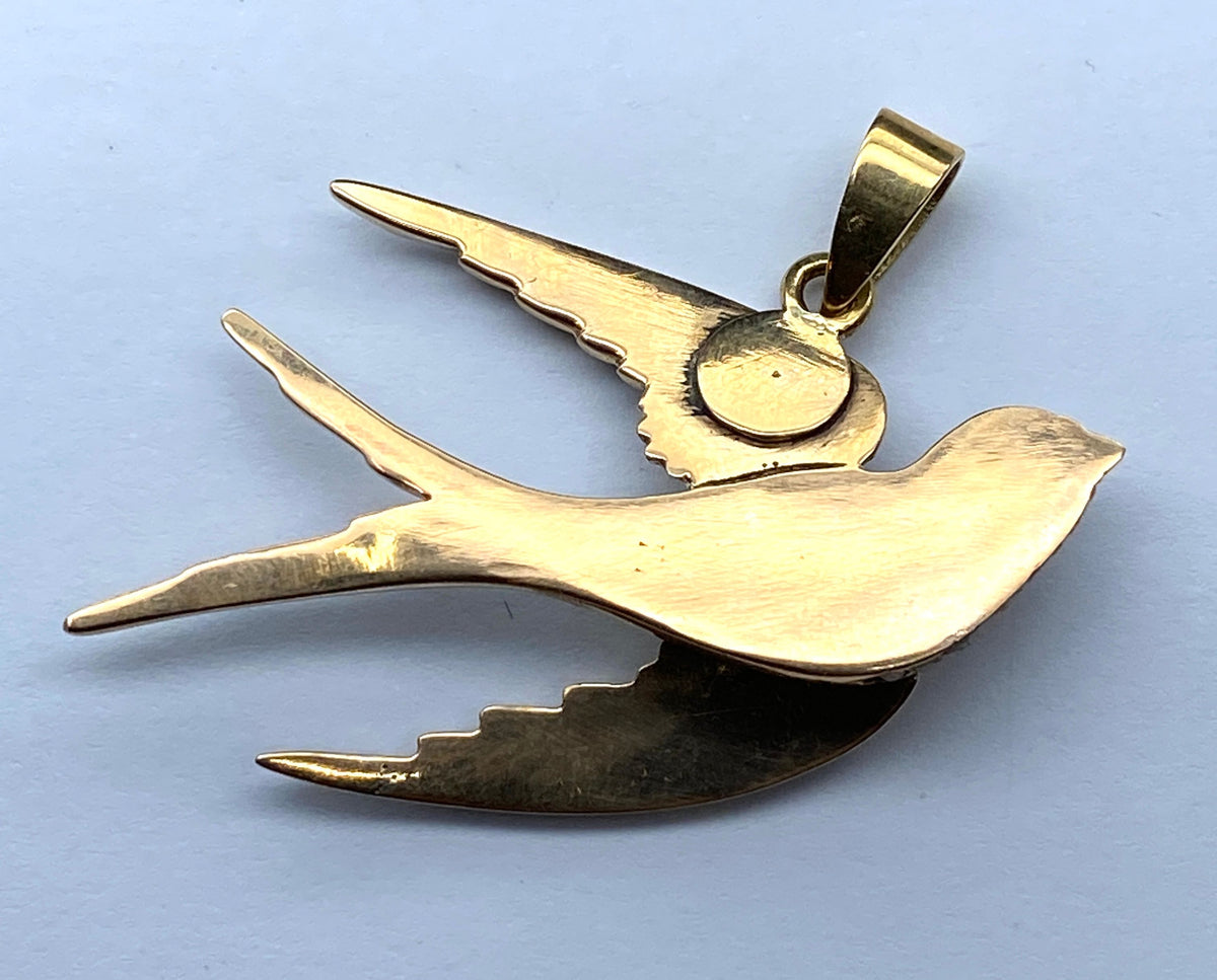 18-carat gold pendant: swallow made of fine pearls and rubies