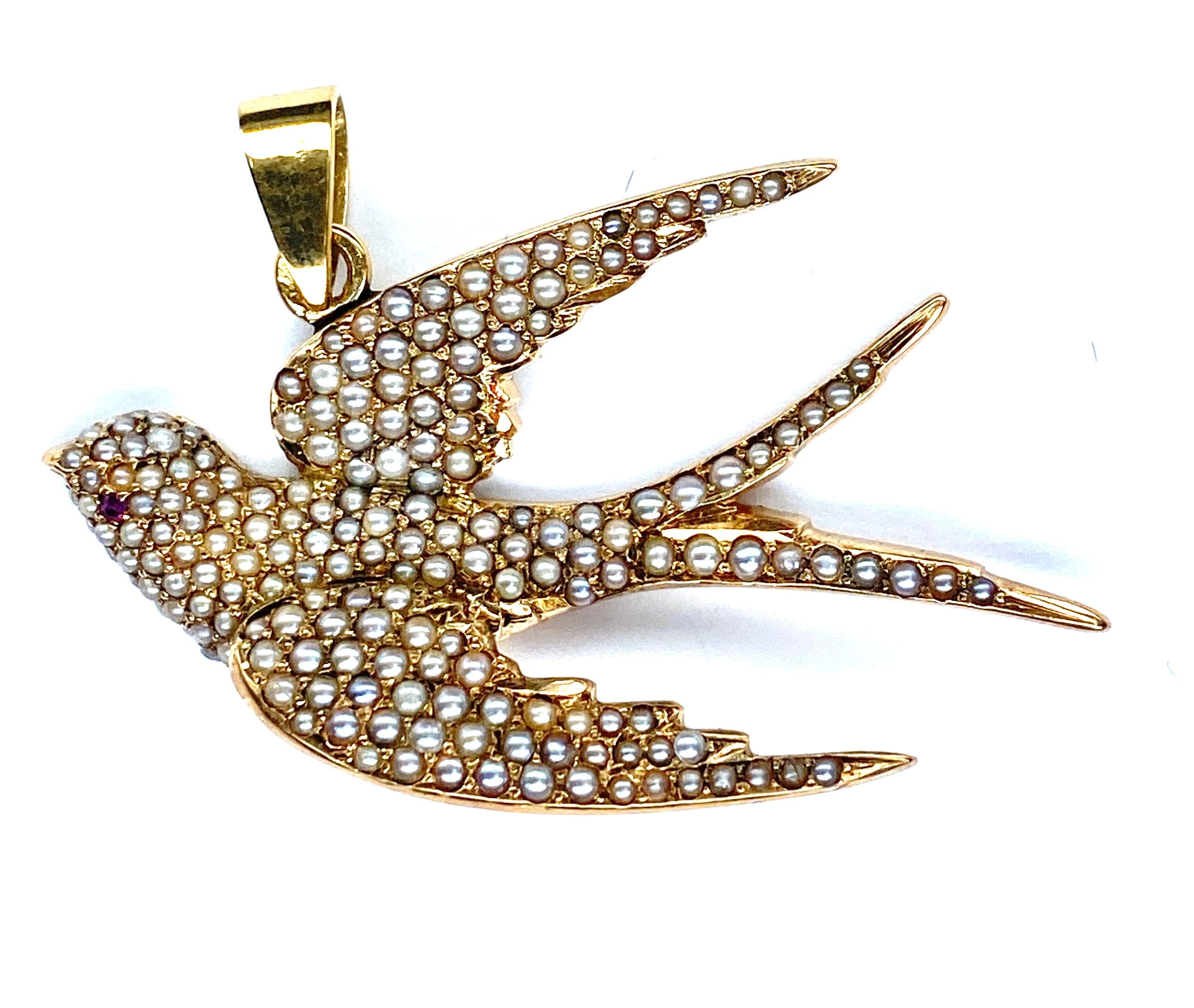 Pendentif en or 18 carats : hirondelle en perles fines et rubis