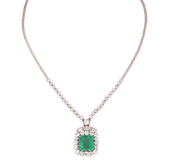 Magnifique collier en or blanc 18k centrée d’une émeraude de Colombie de 14.27 C