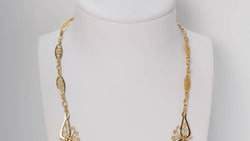 Antique drapery necklace in yellow gold 