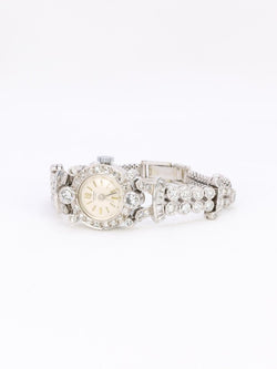 Montre Art Deco or blanc platine diamants - Castafiore