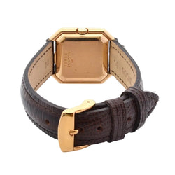 Montre BAUME & MERCIER en or jaune, cuir et saphir - Castafiore