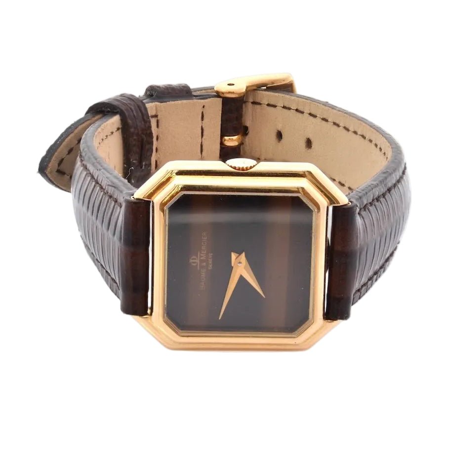 Montre BAUME & MERCIER en or jaune, cuir et saphir - Castafiore