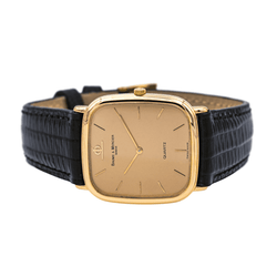 Montre BAUME & MERCIER en or jaune, quartz et cuir - Castafiore