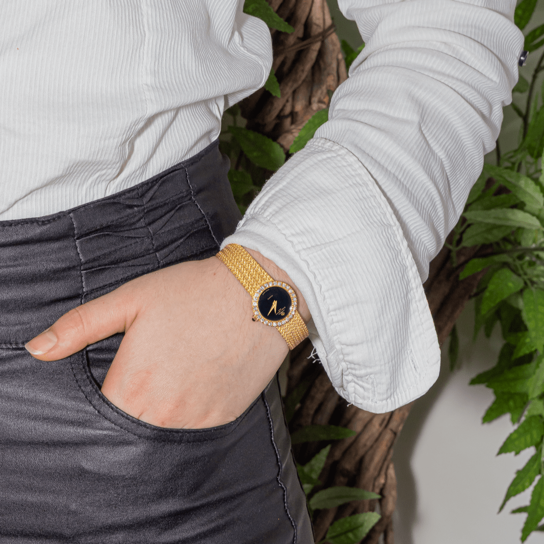 Montre BAUME & MERCIER en or jaune, quartz et diamants - Castafiore