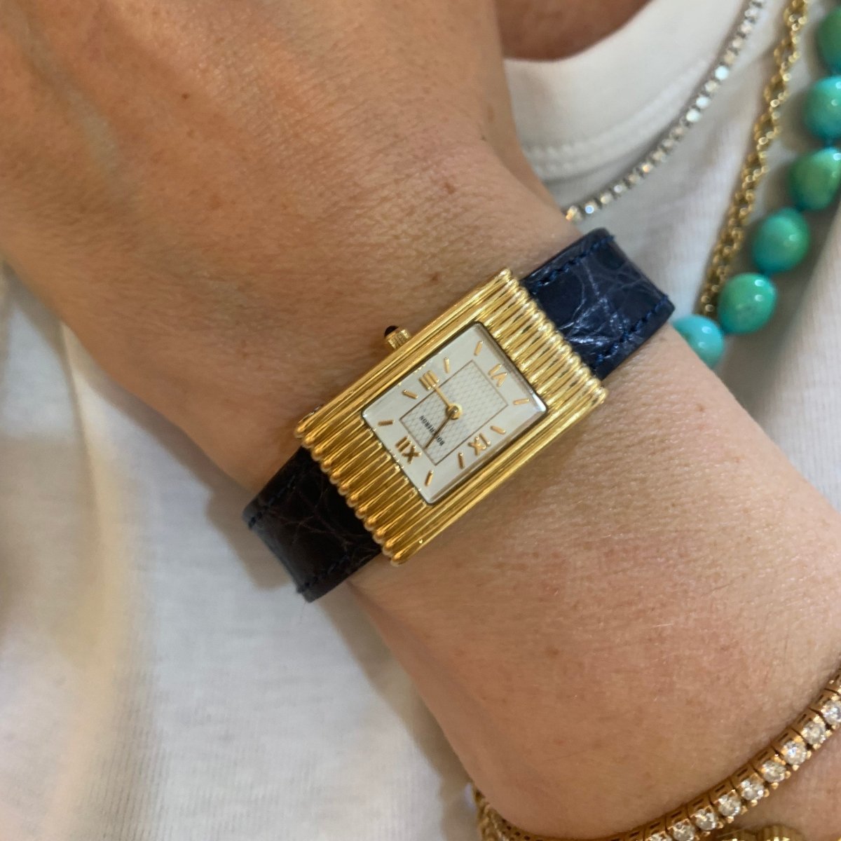 Montre BOUCHERON "Reflet" en or jaune, cuir et quartz - Castafiore