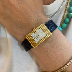 Montre BOUCHERON "Reflet" en or jaune, cuir et quartz - Castafiore