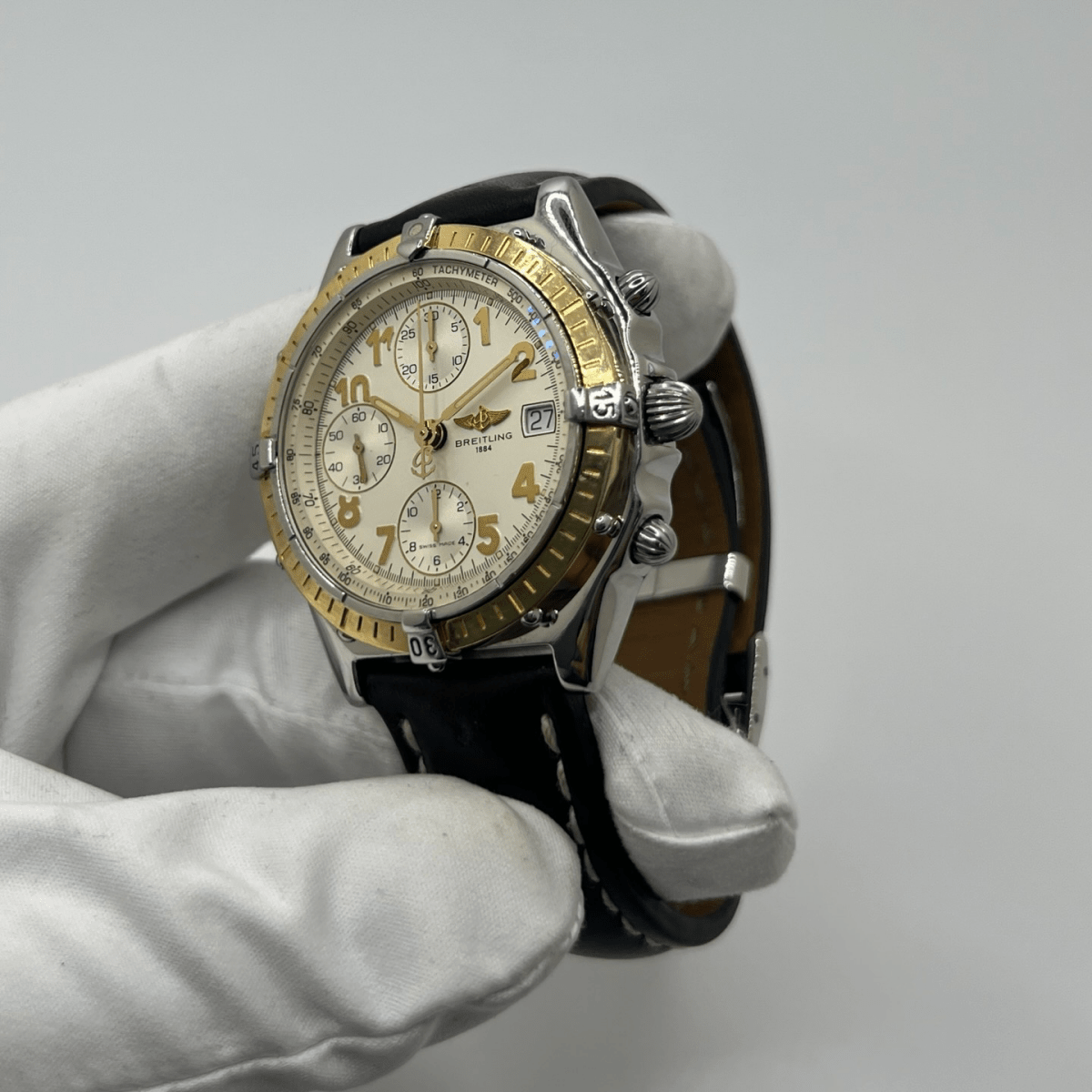 Montre BREITLING "Chronomat" en or jaune, acier et cuir - Castafiore