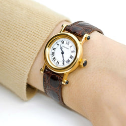 Montre CARTIER "Diabolo" en or jaune, cuir et saphir - Castafiore