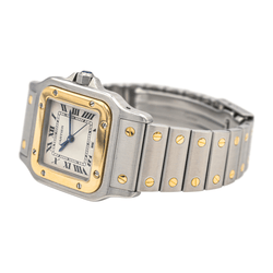Montre Cartier "Santos" en or jaune, acier, saphir, spinelle et quartz - Castafiore