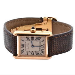 Montre CARTIER "Tank Louis Cartier" en or rose, cuir, plexi et quartz - Castafiore