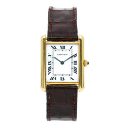 Montre CARTIER "Tank Louis" en or jaune, cuir, saphir et quartz - Castafiore