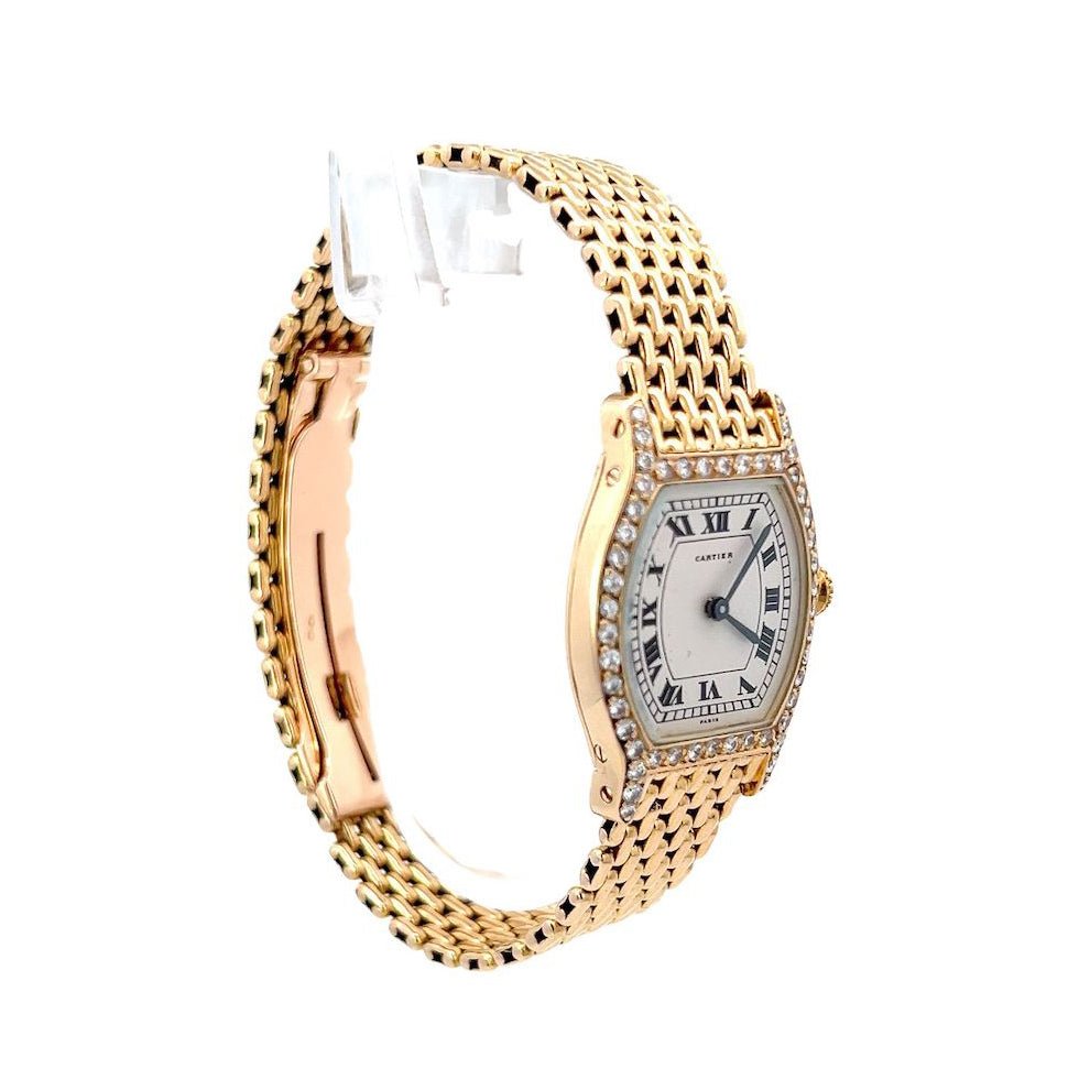 Montre CARTIER "Tortue" en or jaune et diamants - Castafiore