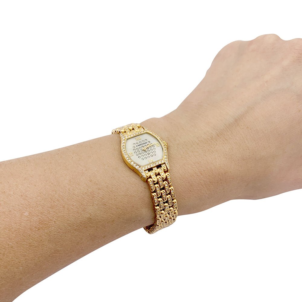 Montre Cartier "Tortue" or jaune, diamants, nacre. - Castafiore