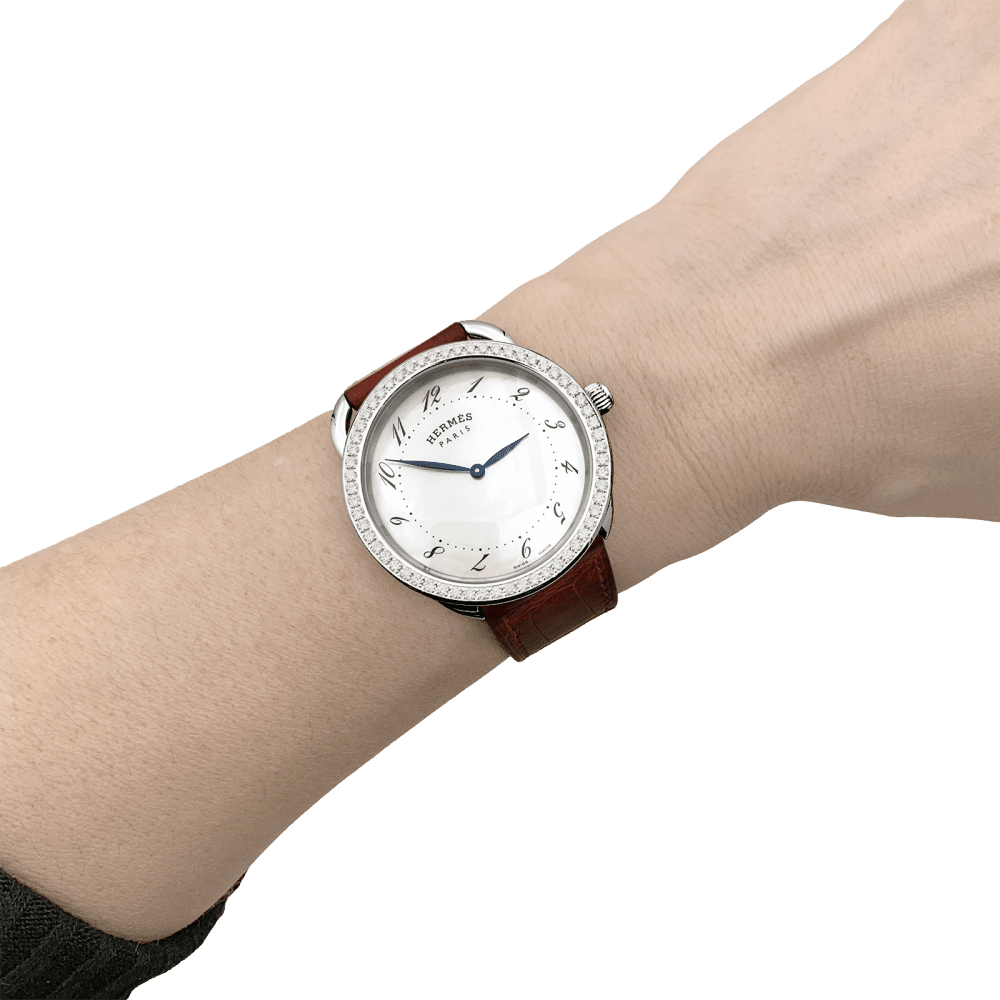 Montre HERMÈS "Arceau" en acier, cuir, nacre et diamants - Castafiore