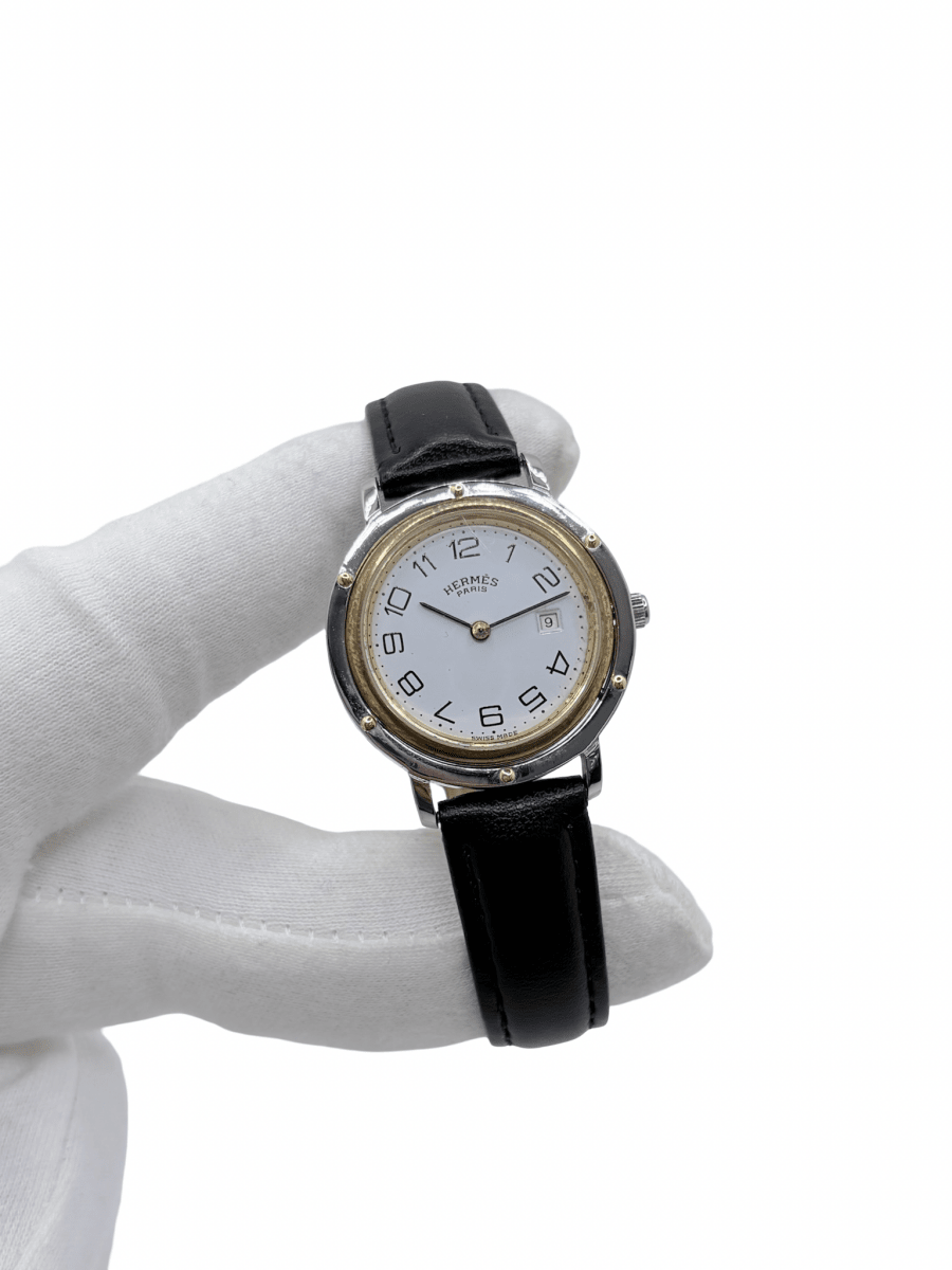 Montre HERMÈS "Clipper" en or jaune, acier et cuir - Castafiore